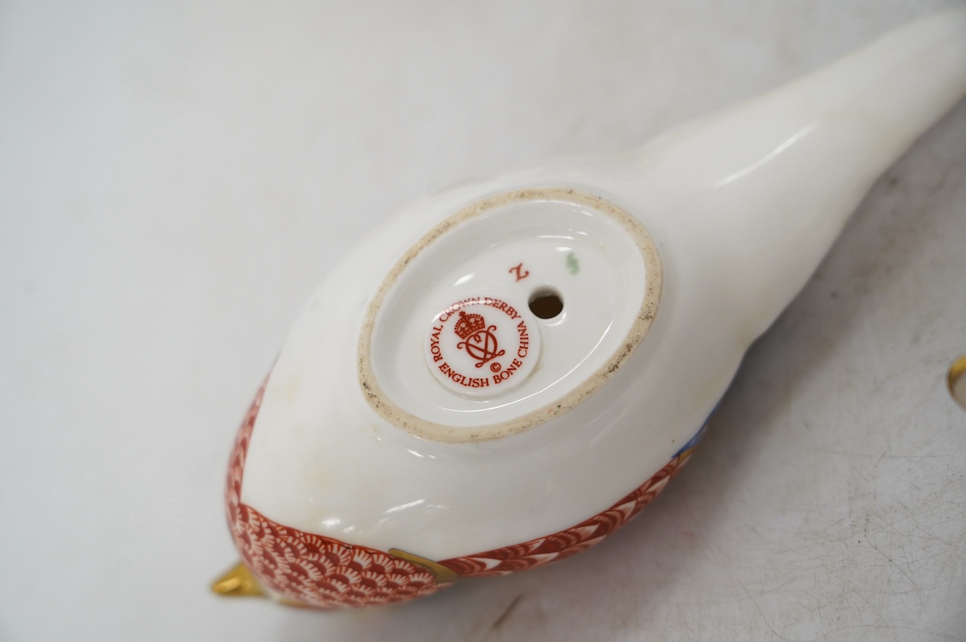 Eight Royal Crown Derby porcelain paperweights in the form of animals including a cat, badger and owl, largest 13.5cm high. Condition - good